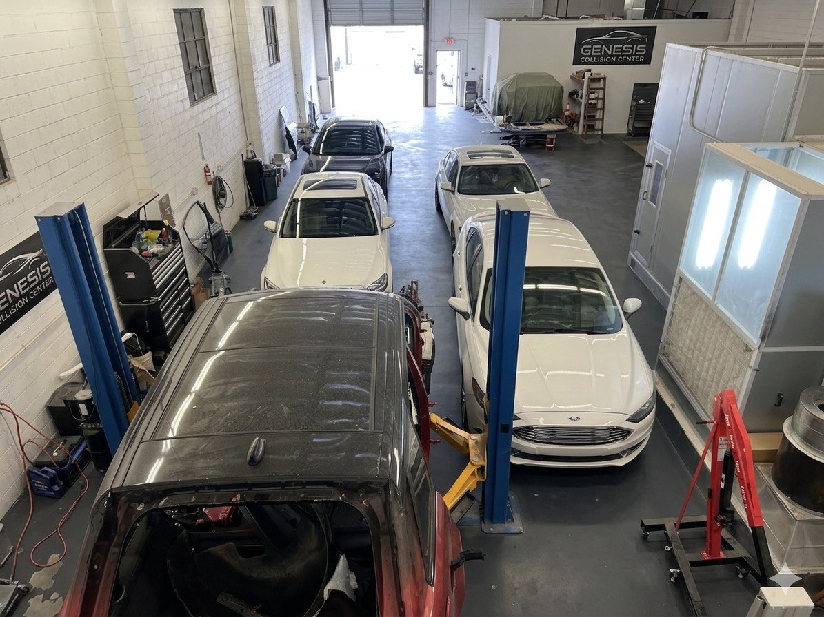 Collision repair shop floor with vehicles in progress